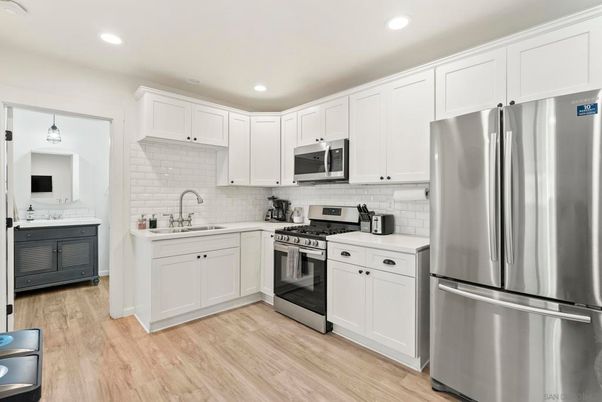 Interior, Kitchen, Pendant Lights, Recessed Lighting, Stainless Steel Appliances, Wood Texture Flooring
