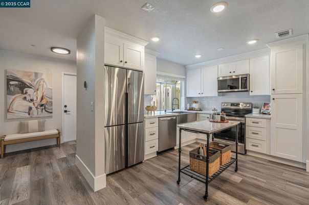 Interior, Kitchen, Recessed Lighting, Stainless Steel Appliances, Wood Texture Flooring