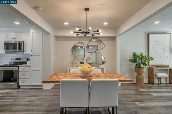 Dining room, Interior, Kitchen, Pendant Lights, Recessed Lighting, Stainless Steel Appliances, Wood Texture Flooring