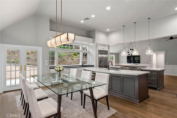 Chandelier, Dining room, Interior, Kitchen, Pendant Lights, Recessed Lighting, Stainless Steel Appliances, Wood Texture Flooring