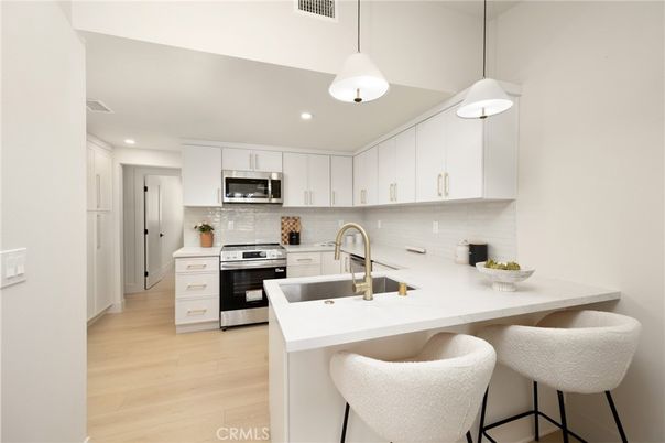 Interior, Kitchen, Pendant Lights, Recessed Lighting, Stainless Steel Appliances, Wood Texture Flooring