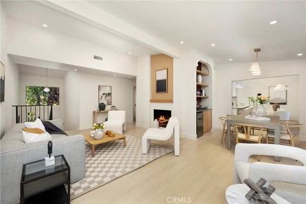 Dining room, Fireplace, Interior, Living room, Pendant Lights, Recessed Lighting, Wood Texture Flooring