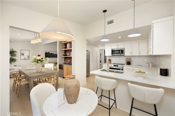 Dining room, Interior, Kitchen, Pendant Lights, Recessed Lighting, Stainless Steel Appliances, Wood Texture Flooring