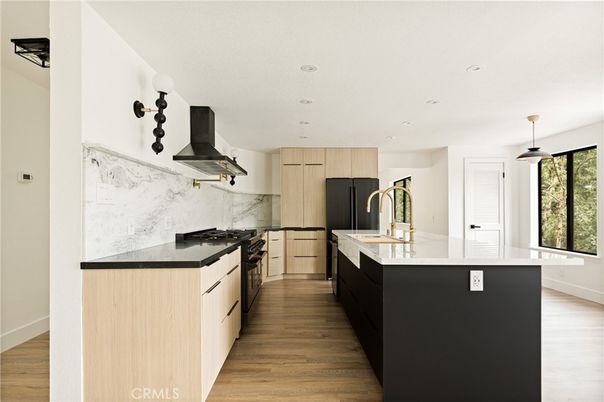 Interior, Kitchen, Marble Walls, Pendant Lights, Recessed Lighting, Stainless Steel Appliances, Wood Texture Flooring