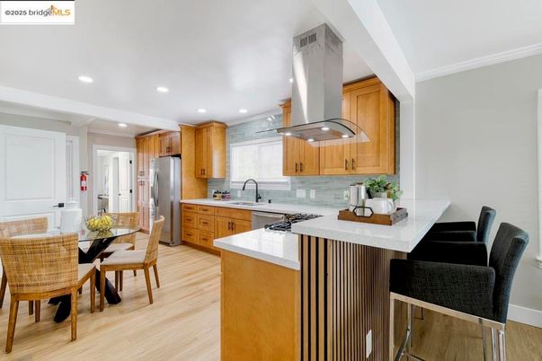 Dining room, Interior, Kitchen, Recessed Lighting, Stainless Steel Appliances, Wood Texture Flooring