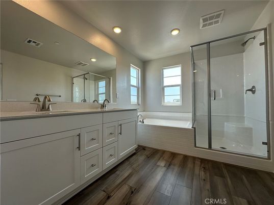 Bathroom, Dual Sink Vanities, Glass Shower, Interior, Recessed Lighting, Wood Texture Flooring