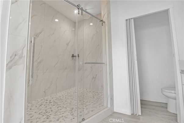 Bathroom, Glass Shower, Interior, Marble Walls, Wood Texture Flooring