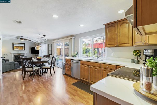 Dining room, Fireplace, Interior, Kitchen, Pendant Lights, Recessed Lighting, Wood Texture Flooring