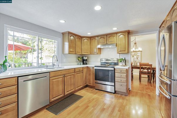 Dining room, Interior, Kitchen, Recessed Lighting, Stainless Steel Appliances, Wood Texture Flooring