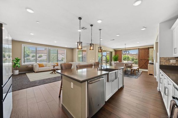 Dining room, Interior, Kitchen, Living room, Pendant Lights, Recessed Lighting, Stainless Steel Appliances, Wood Texture Flooring