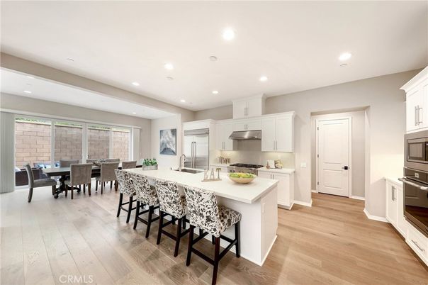 Dining room, Interior, Kitchen, Recessed Lighting, Stainless Steel Appliances, Wood Texture Flooring