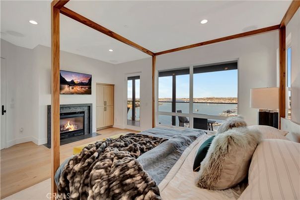 Bedroom, Fireplace, Interior, Recessed Lighting, Water, Wood Texture Flooring