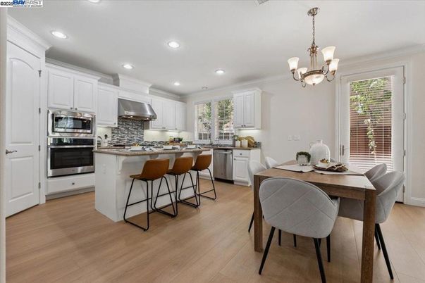 Chandelier, Dining room, Interior, Kitchen, Recessed Lighting, Stainless Steel Appliances, Wood Texture Flooring