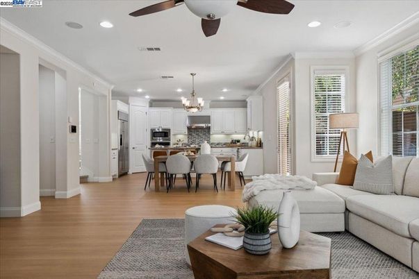 Chandelier, Dining room, Interior, Kitchen, Living room, Recessed Lighting, Stainless Steel Appliances, Wood Texture Flooring