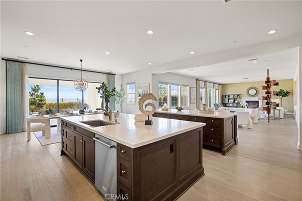 Chandelier, Dining room, Fireplace, Interior, Kitchen, Living room, Pendant Lights, Recessed Lighting, Wood Texture Flooring