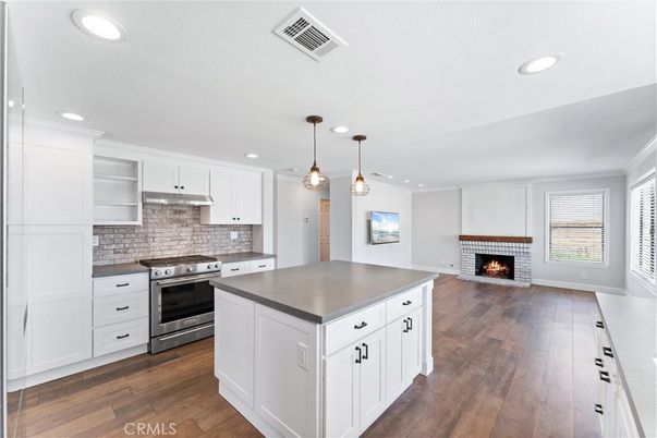 Fireplace, Interior, Kitchen, Pendant Lights, Recessed Lighting, Stainless Steel Appliances, Wood Texture Flooring