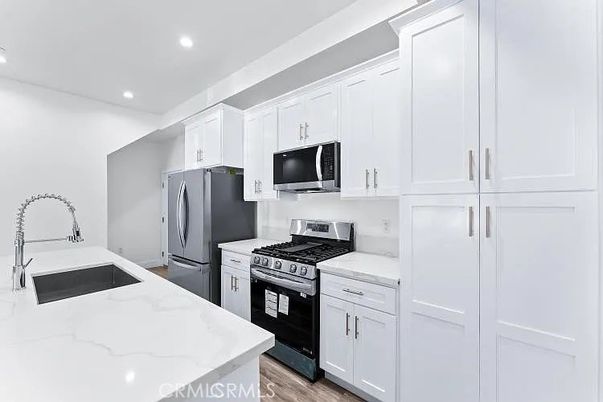 Interior, Kitchen, Recessed Lighting, Stainless Steel Appliances, Wood Texture Flooring