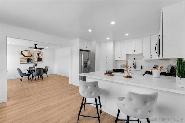 Dining room, Interior, Kitchen, Recessed Lighting, Stainless Steel Appliances, Wood Texture Flooring