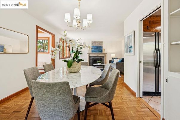 Chandelier, Dining room, Fireplace, Interior, Living room, Stainless Steel Appliances, Wood Texture Flooring