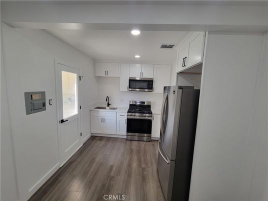 Interior, Kitchen, Recessed Lighting, Stainless Steel Appliances, Wood Texture Flooring