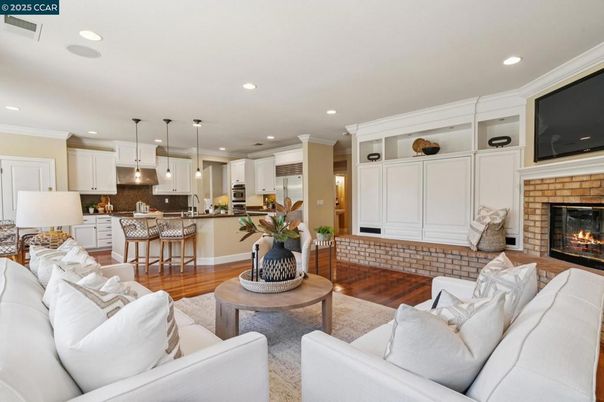 Fireplace, Interior, Kitchen, Living room, Pendant Lights, Recessed Lighting, Stainless Steel Appliances, Wood Texture Flooring