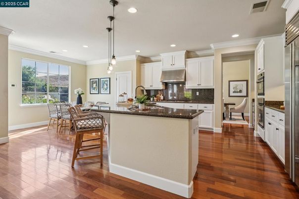 Dining room, Interior, Kitchen, Pendant Lights, Recessed Lighting, Stainless Steel Appliances, Wood Texture Flooring