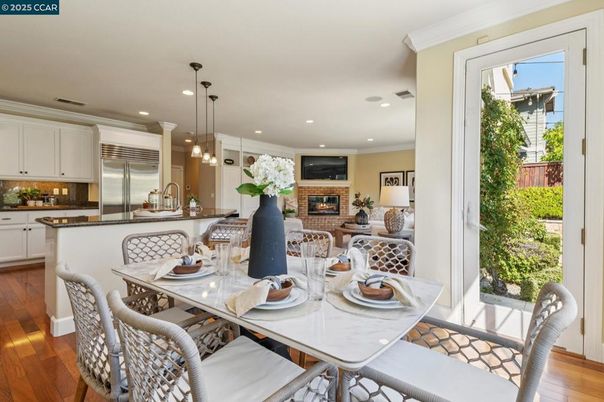 Dining room, Fireplace, Interior, Kitchen, Pendant Lights, Recessed Lighting, Stainless Steel Appliances, Wood Texture Flooring