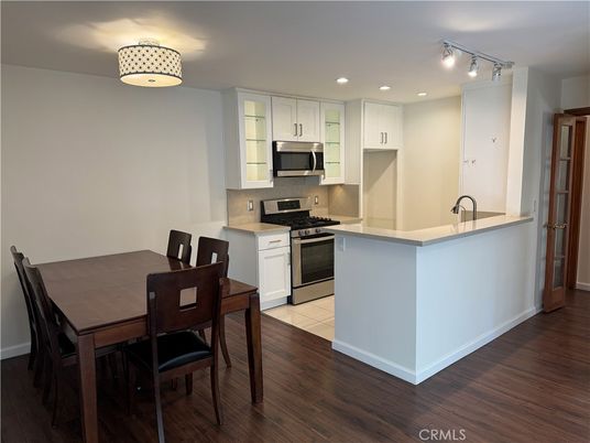 Dining room, Interior, Kitchen, Recessed Lighting, Stainless Steel Appliances, Wood Texture Flooring