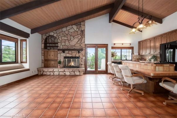 Chandelier, Dining room, Fireplace, Interior, Kitchen, Pendant Lights, Stone Walls, Wooden Beams, Wooden Ceilings