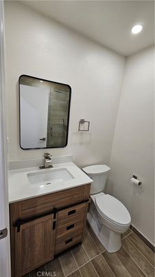 Bathroom, Dual Sink Vanities, Interior, Recessed Lighting, Wood Texture Flooring