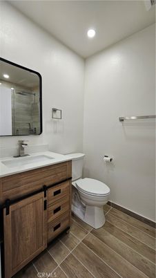 Bathroom, Dual Sink Vanities, Interior, Recessed Lighting, Wood Texture Flooring