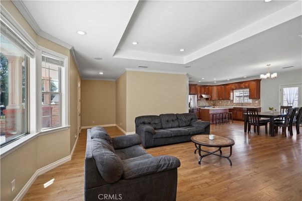 Chandelier, Dining room, Interior, Kitchen, Living room, Recessed Lighting, Stainless Steel Appliances, Wood Texture Flooring