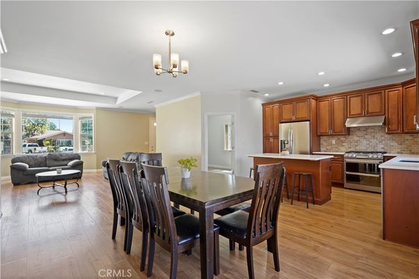 Chandelier, Dining room, Interior, Kitchen, Living room, Recessed Lighting, Stainless Steel Appliances, Wood Texture Flooring