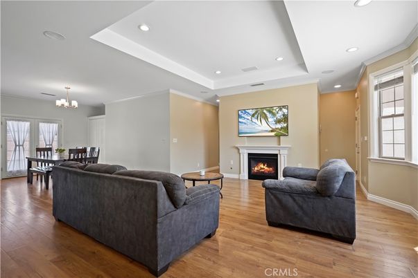 Chandelier, Dining room, Fireplace, Interior, Living room, Recessed Lighting, Wood Texture Flooring