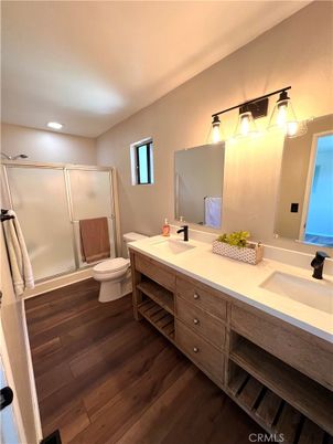 Bathroom, Dual Sink Vanities, Glass Shower, Interior, Recessed Lighting, Wood Texture Flooring