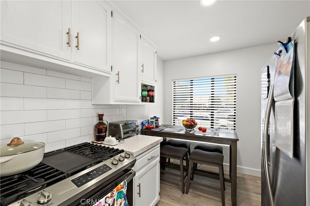 Dining room, Interior, Kitchen, Recessed Lighting, Stainless Steel Appliances, Wood Texture Flooring