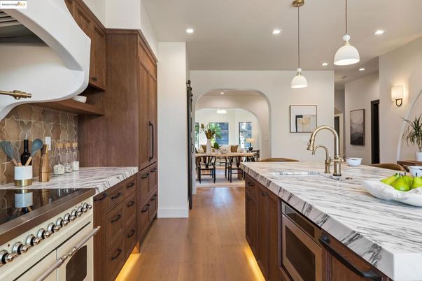Dining room, Interior, Kitchen, Pendant Lights, Recessed Lighting, Stainless Steel Appliances, Wood Texture Flooring