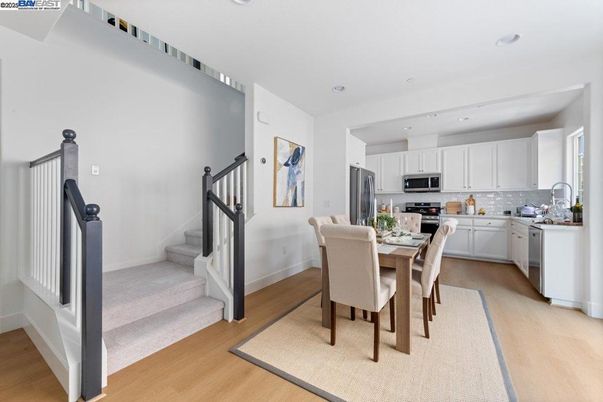 Dining room, Interior, Kitchen, Recessed Lighting, Stainless Steel Appliances, Wood Texture Flooring