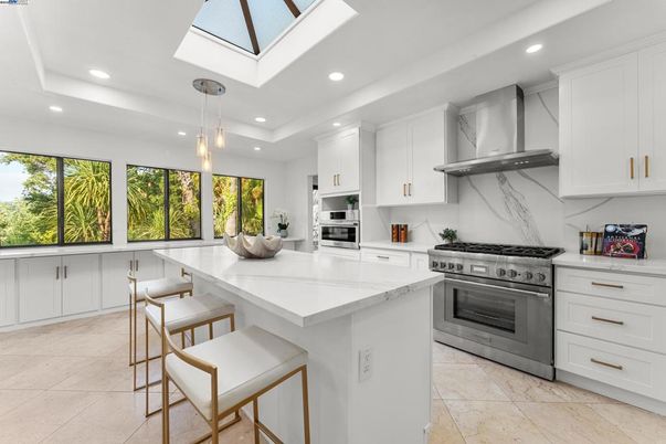 Interior, Kitchen, Marble Walls, Pendant Lights, Recessed Lighting, Stainless Steel Appliances
