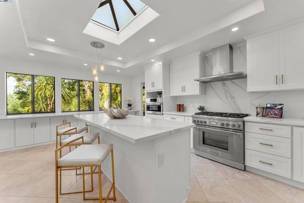 Interior, Kitchen, Marble Walls, Pendant Lights, Recessed Lighting, Stainless Steel Appliances