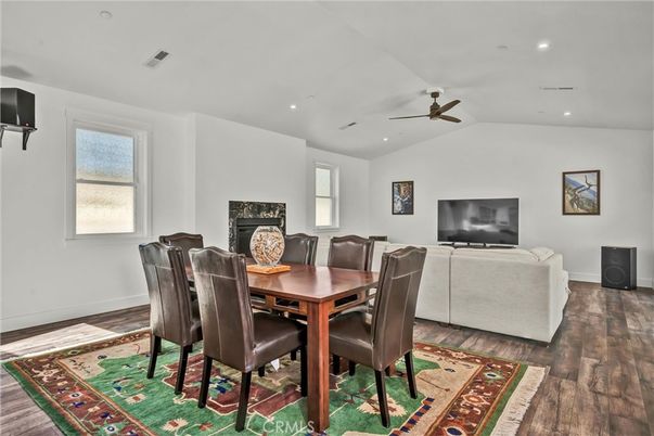 Dining room, Fireplace, Interior, Living room, Recessed Lighting, Wood Texture Flooring