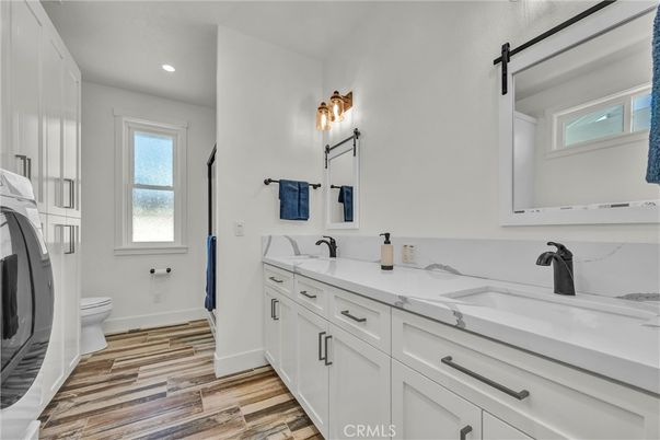 Bathroom, Dual Sink Vanities, Interior, Recessed Lighting, Wood Texture Flooring