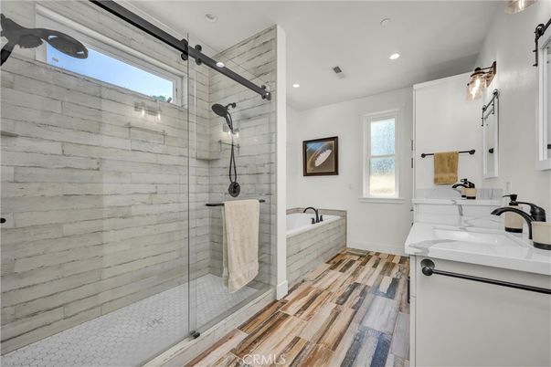 Bathroom, Dual Sink Vanities, Glass Shower, Interior, Recessed Lighting, Wood Texture Flooring