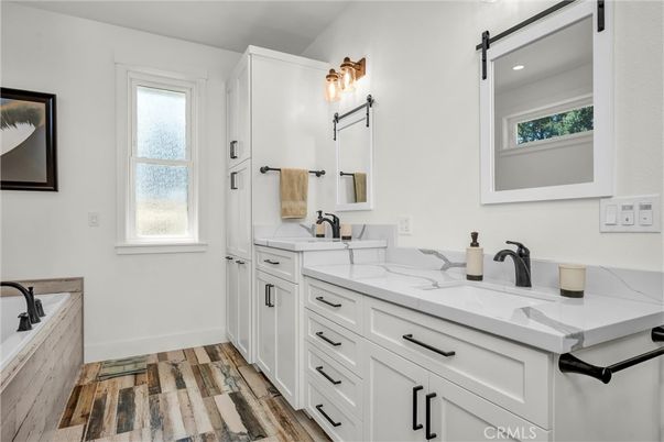 Bathroom, Dual Sink Vanities, Interior, Recessed Lighting, Wood Texture Flooring