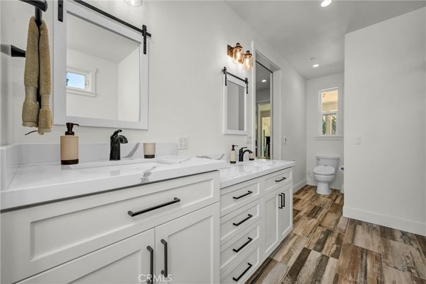 Bathroom, Dual Sink Vanities, Interior, Recessed Lighting, Wood Texture Flooring