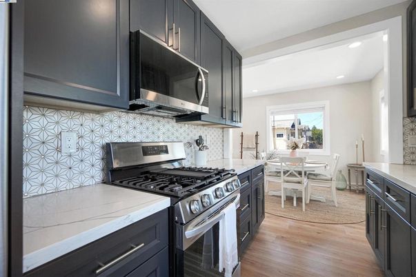 Dining room, Interior, Kitchen, Recessed Lighting, Stainless Steel Appliances, Wood Texture Flooring