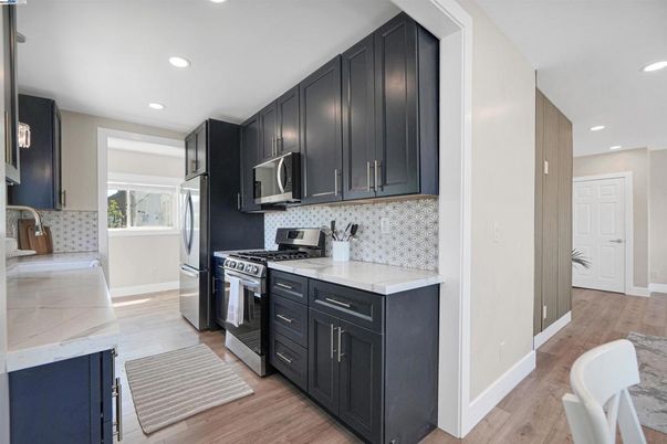 Interior, Kitchen, Recessed Lighting, Stainless Steel Appliances, Wood Texture Flooring