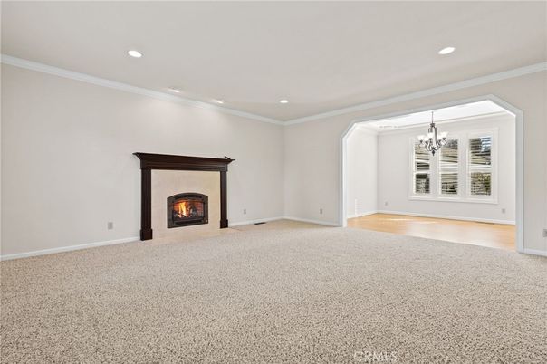 Chandelier, Empty room, Fireplace, Interior, Recessed Lighting, Wood Texture Flooring