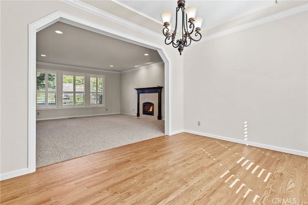 Chandelier, Empty room, Fireplace, Interior, Recessed Lighting, Wood Texture Flooring