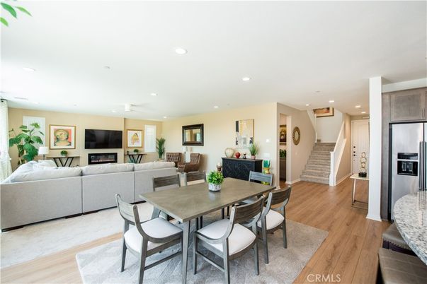 Dining room, Fireplace, Interior, Kitchen, Living room, Recessed Lighting, Stainless Steel Appliances, Wood Texture Flooring